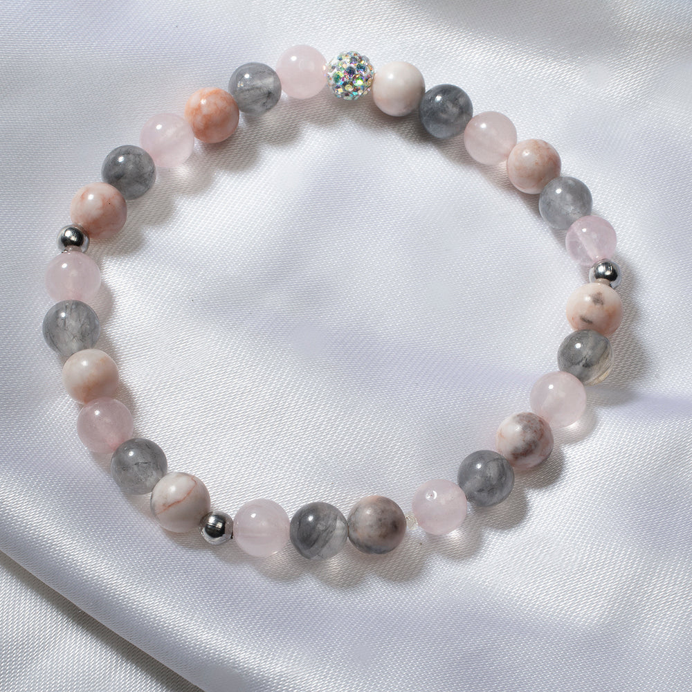 
                  
                    Bracelet élastique de quartz rose, quartz fumé et jade picasso 
                  
                